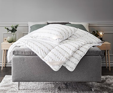 TRONFJELLET range thrown over a double bed with matching pillow
